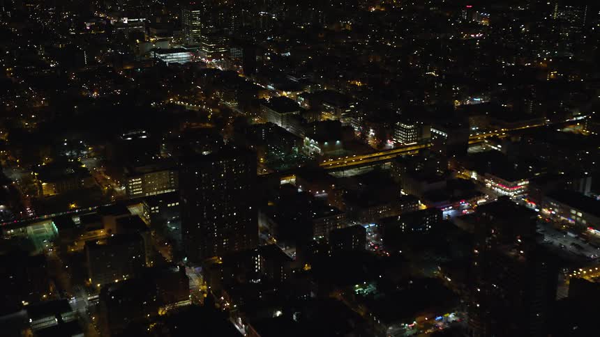 A metropolitan city at night and several residential and street lights are on