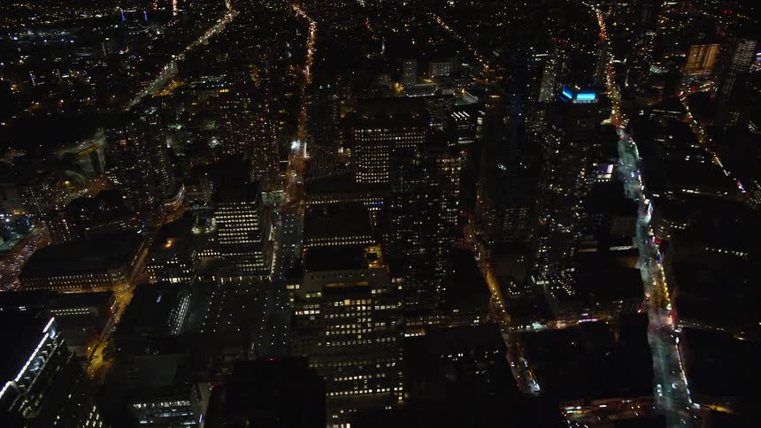 Aerial of the city with illuminated buildings at night
