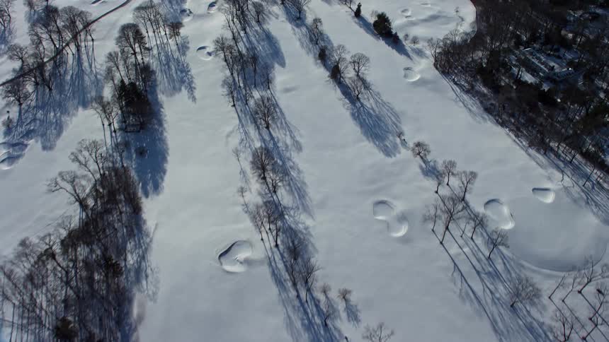 Aerial view of an urban city covered in snow
