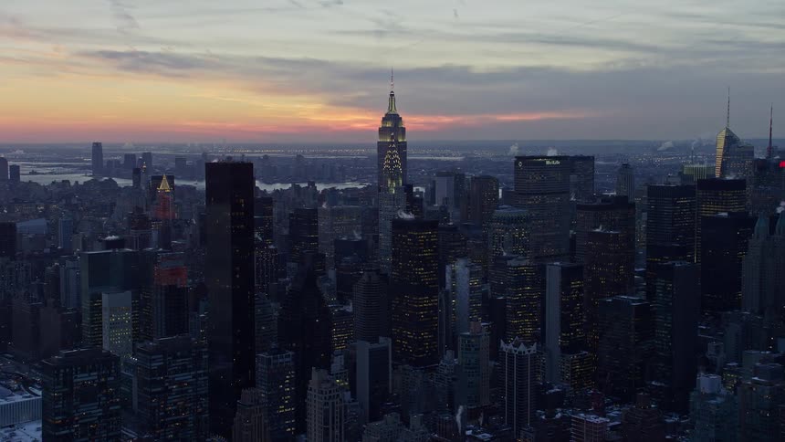 An aerial view of a metropolitan city filled with skyscrapers