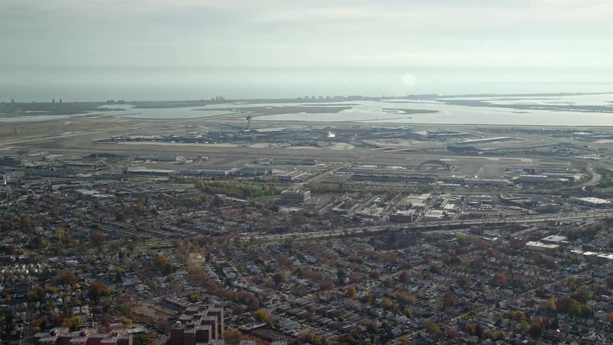 An aerial view of a buildings in a suburb closer to the river