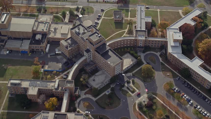 Aerial view of a building with blocks in the midst of an urban city