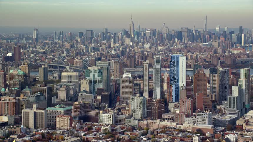 Aerial of the city with glass buildings during sunset