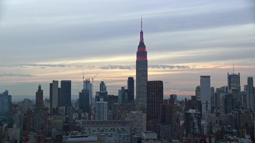Aerial view of a metropolitan city with skyscrapers under a morning sky