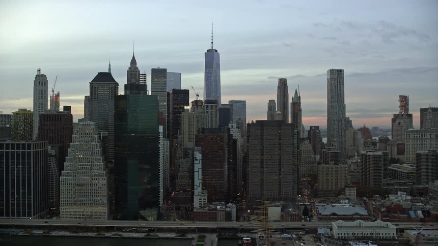 A city with lots of high rise buildings with an high way running through it