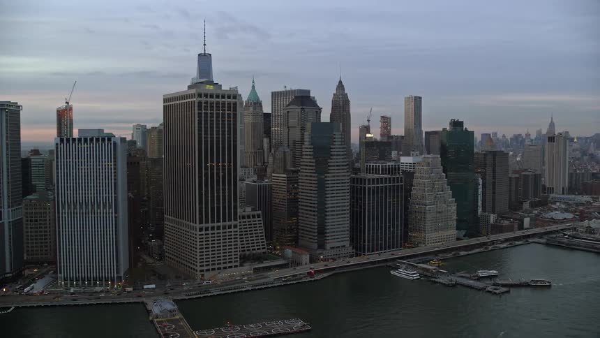 A metropolitan city with commercial buildings facing the sea