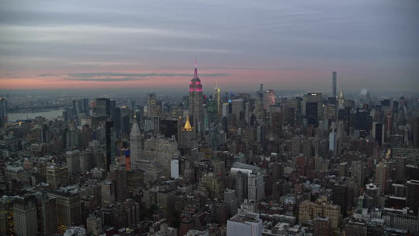 Aerial of buildings in a metropolitan area area at sunset