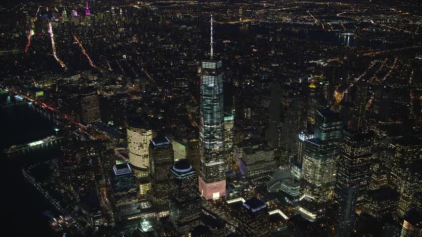 Aerial panorama of a metropolis with illuminated skyscrapers during the night