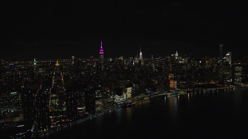 Buildings and moving cars in a metropolitan area at night