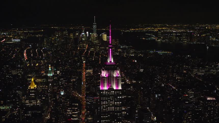 An aerial view of a pink glowing tower