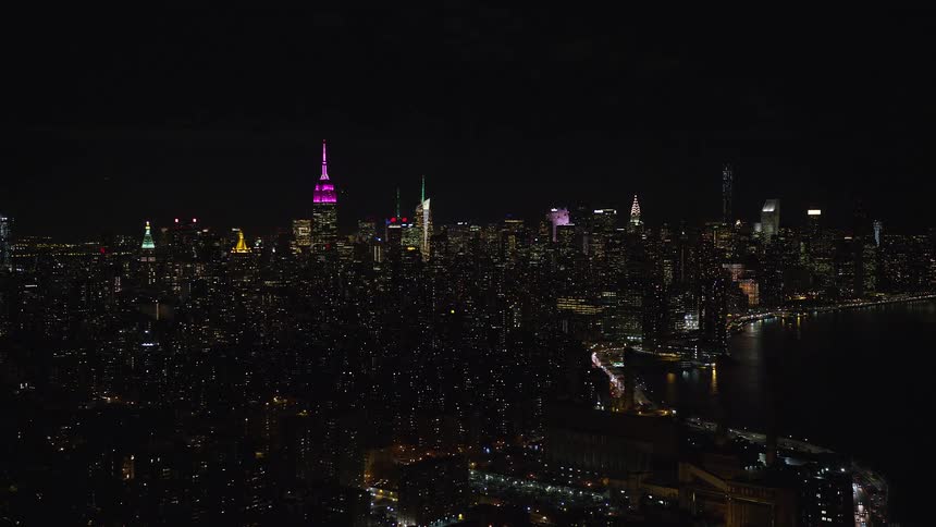 Nighttime view of a metropolis by the seaside