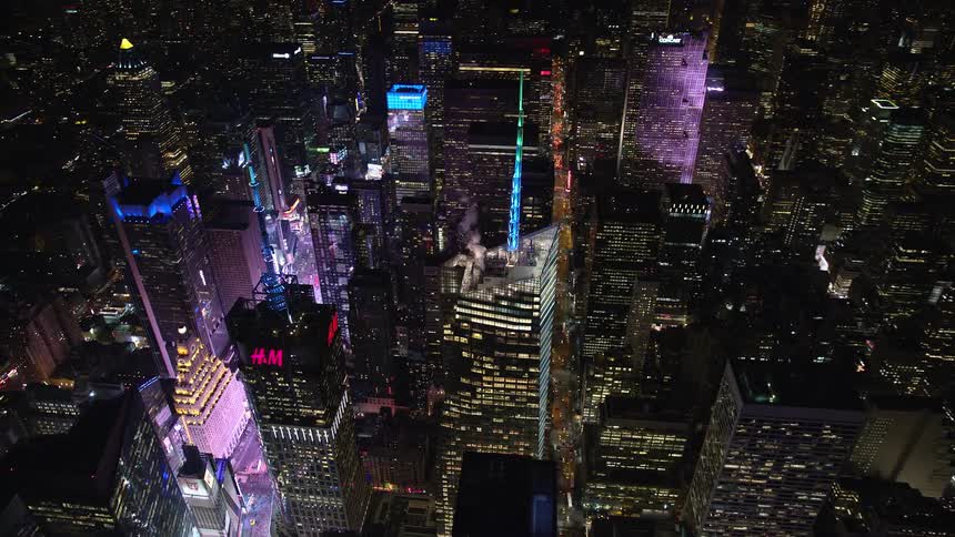 Aerial panorama of a nighttime metropolis with skyscrapers