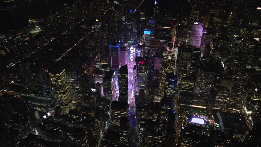 Aerial panorama of a metropolis at night with billboards and lighting