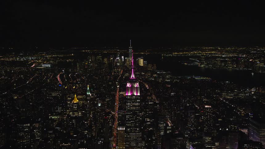 Nighttime panorama of a metropolis with illuminated skyscrapers