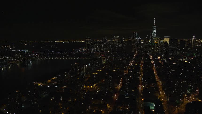 Aerial and panoramic view of a metropolis by the seaside at night