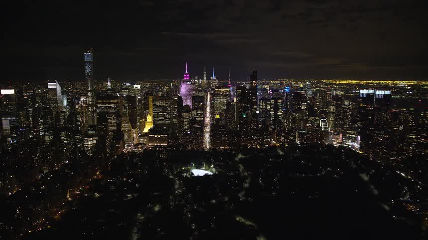Nighttime panorama of a metropolis with illuminated skyscrapers