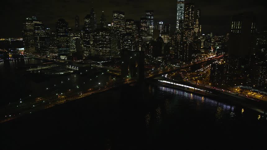 Aerial view of new york skyline and bridge at night