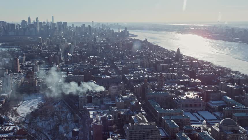 Skyline of a city during winter with frozen sea during the morning