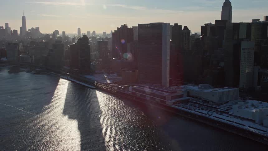 An aerial view of skyscrapers close to the shore