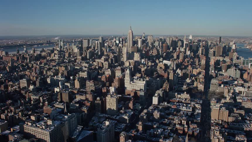 Aerial panorama of a metropolis by the seaside with skyscrapers