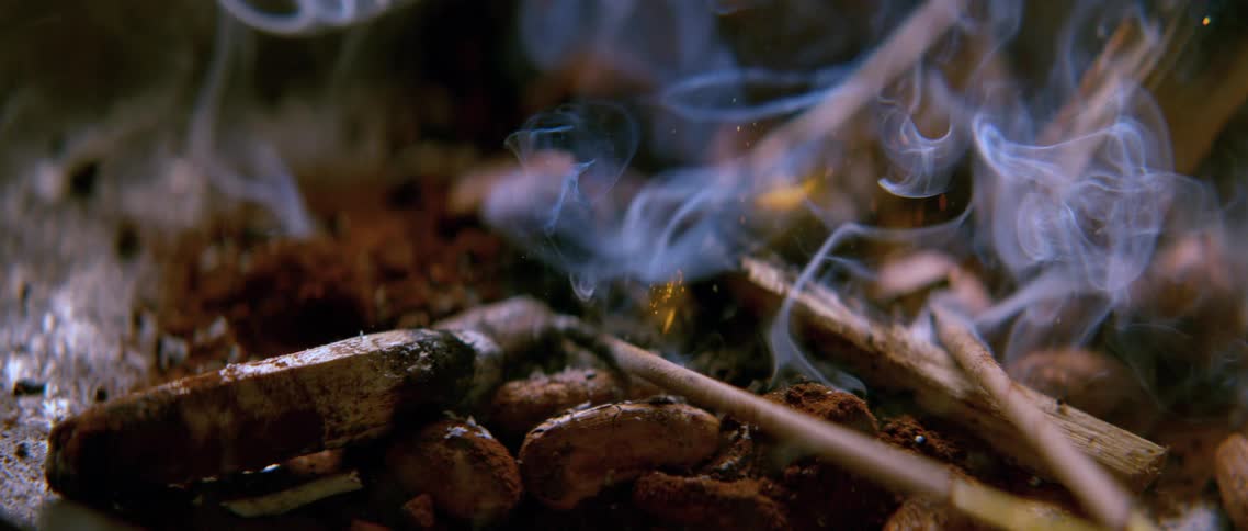 Small wood chips falling with fire and smoke