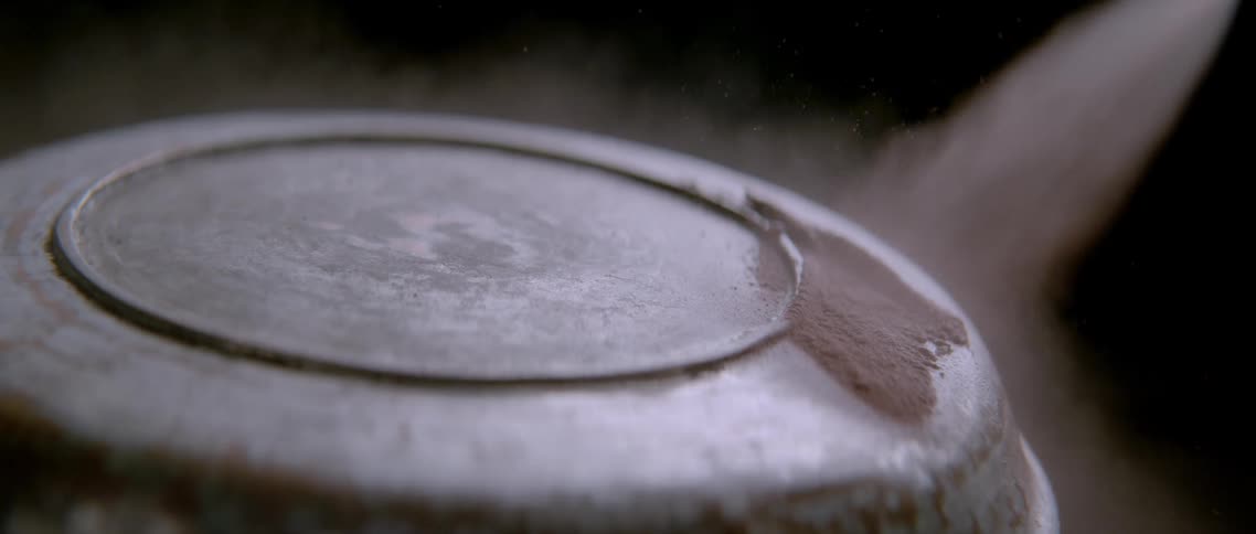 Closeup of a ray passing over a metallic surface