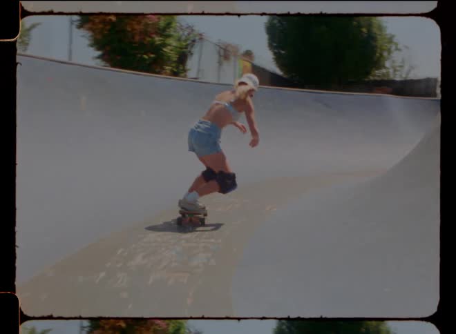 A female skateboarding in a skateboarding park