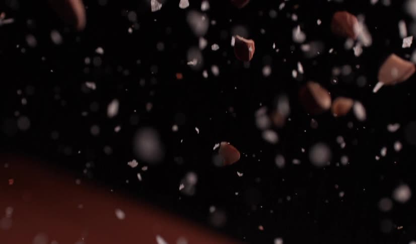 Various particles and pieces of something broken that are falling