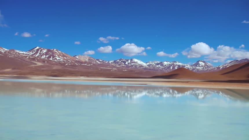 Sea with clear water in nature with mountains in the desert