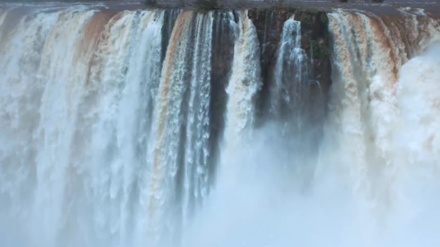 Waterfalls splash as they rapidly flow over the cliff