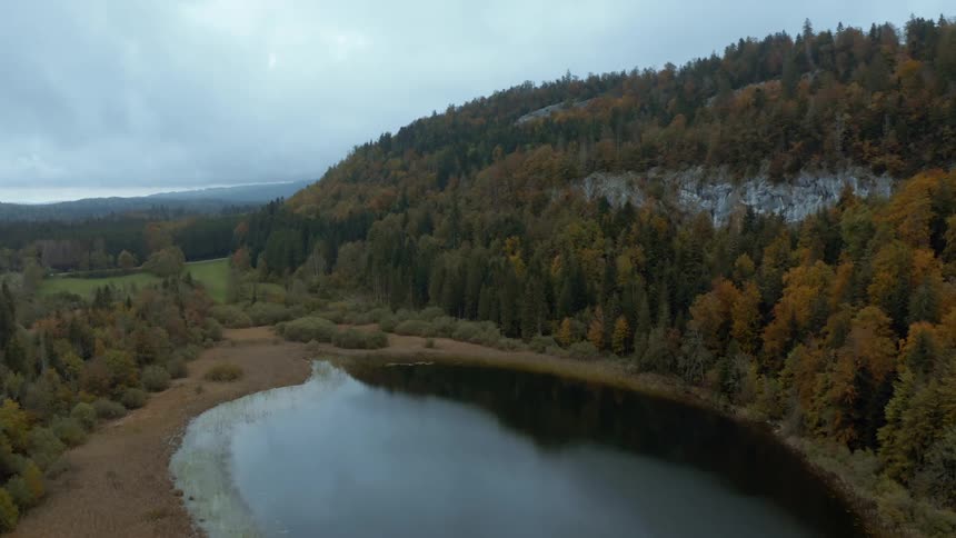 Aerial view of a lake near a mountain in the countryside