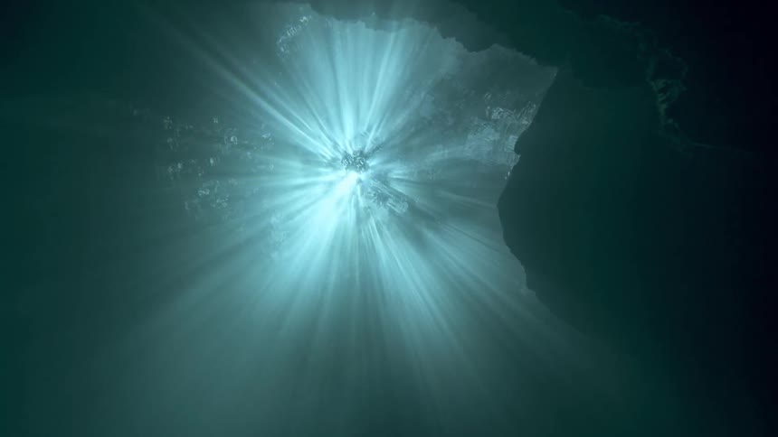 Inside the turquoise blue sea with sunlight reflection