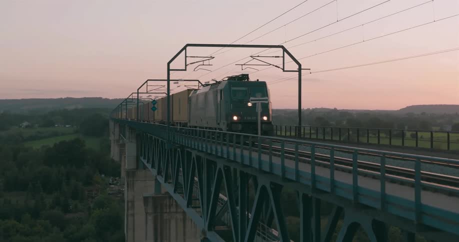 A cargo train moving across the geul valley bridge captured from above