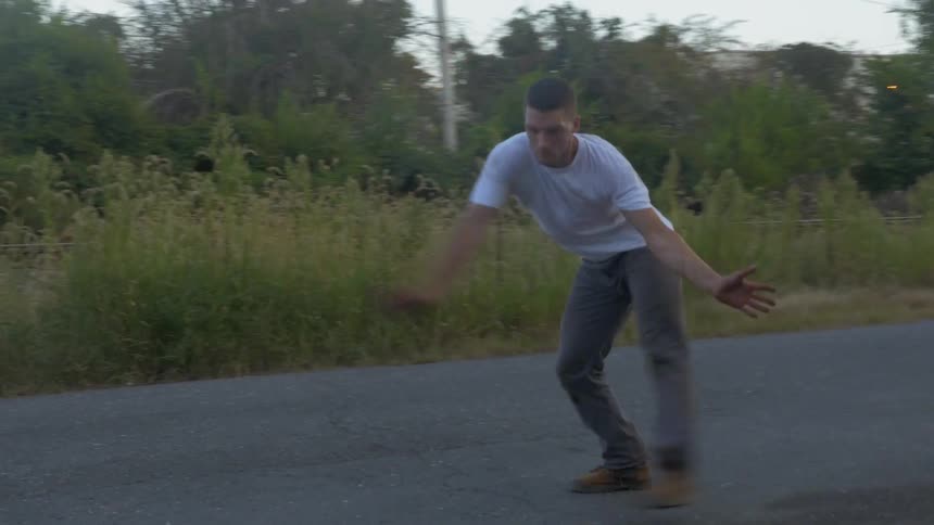A man is dancing outside
