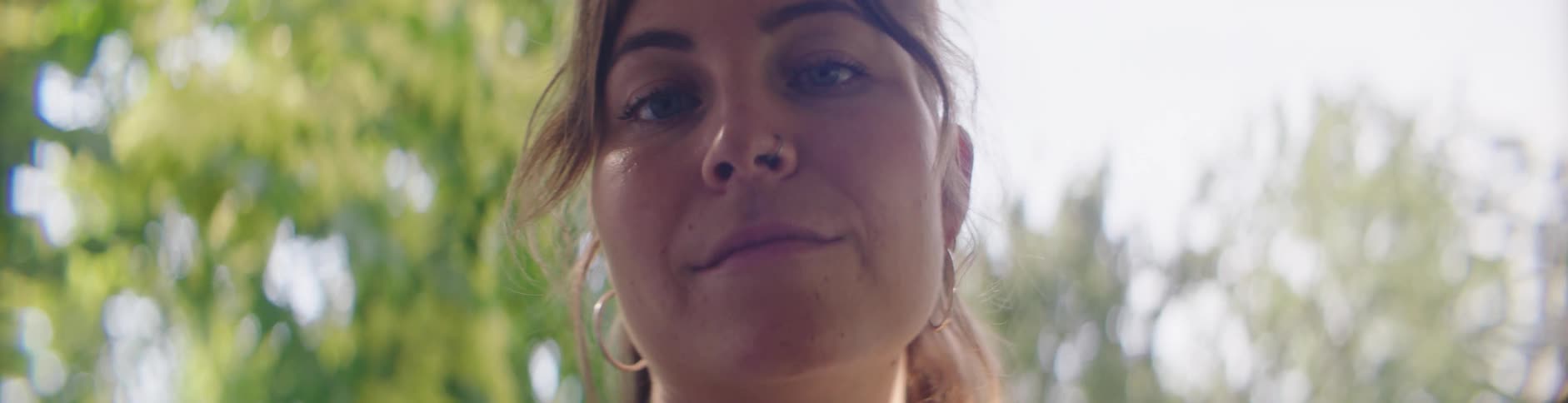 A woman turns her head and smiles