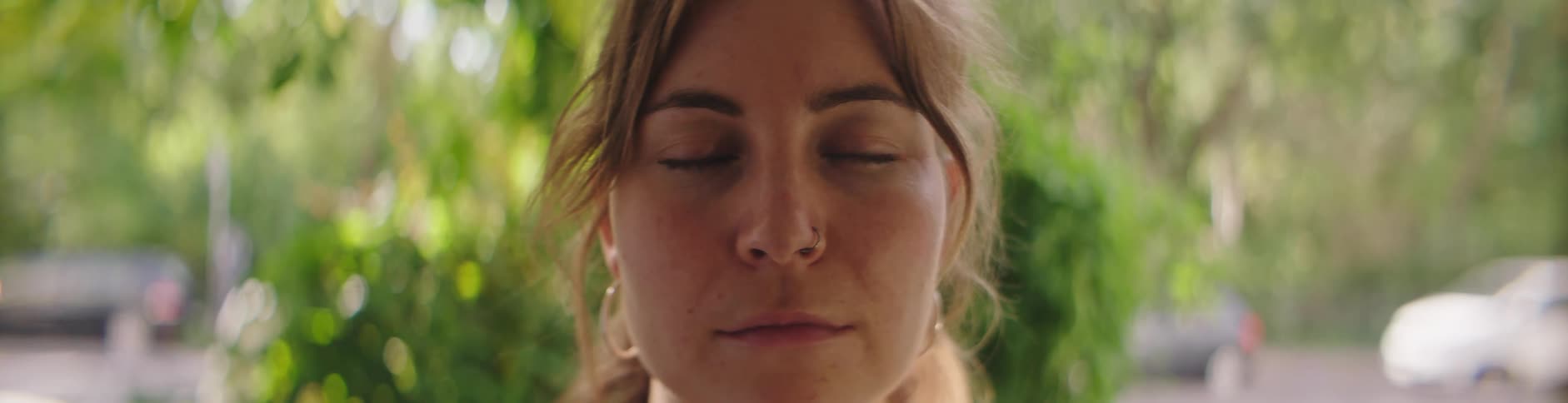 Close up of woman doing yoga opens her eyes
