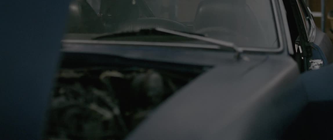 Old car with the hood up