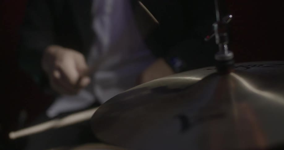 A man is playing the drums