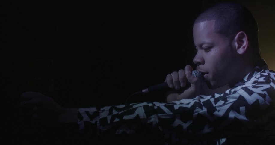 A man is singing into a microphone