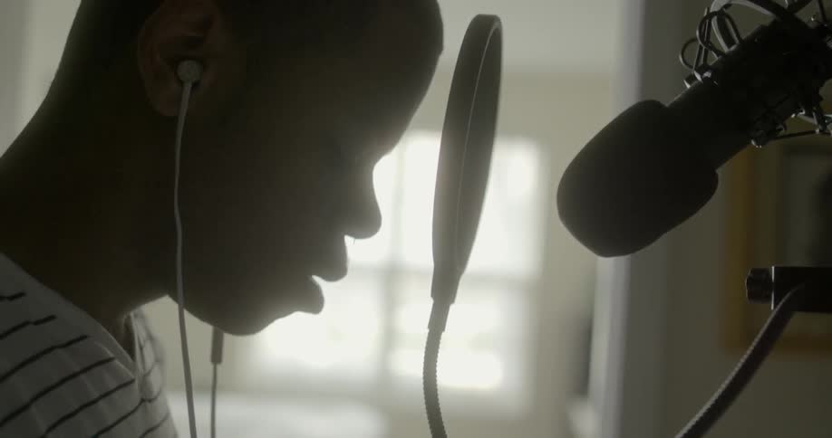 Singer gently bobbing his head to the music