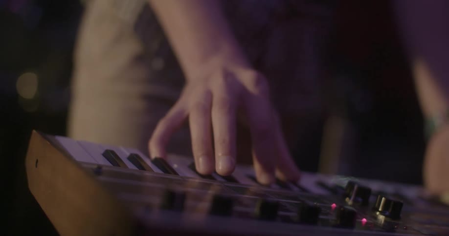Close-up of someone playing a keyboard