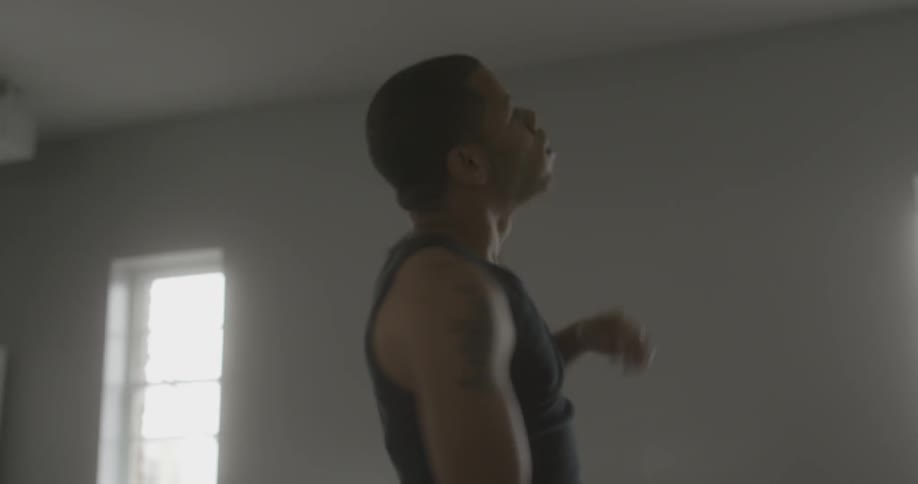 A man is dancing in a room