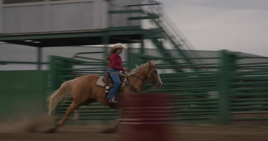 Woman running at high speed with her horse practicing equestrianism