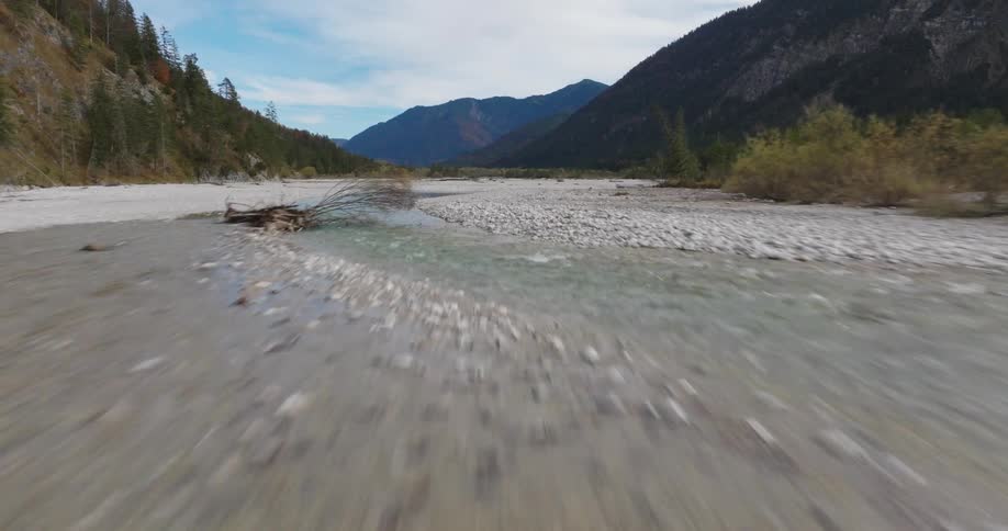 View from the ground with rivers and a chain of mountains around