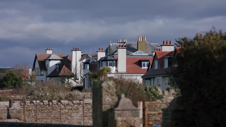 View of townhouses in a residential neighborhood on a cloudy day