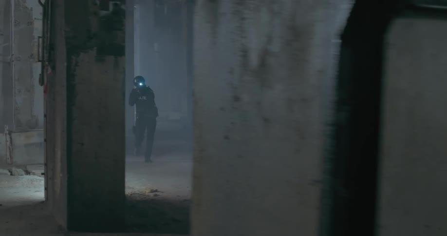 View of a tactical team of 4 police officers entering an indoor environment