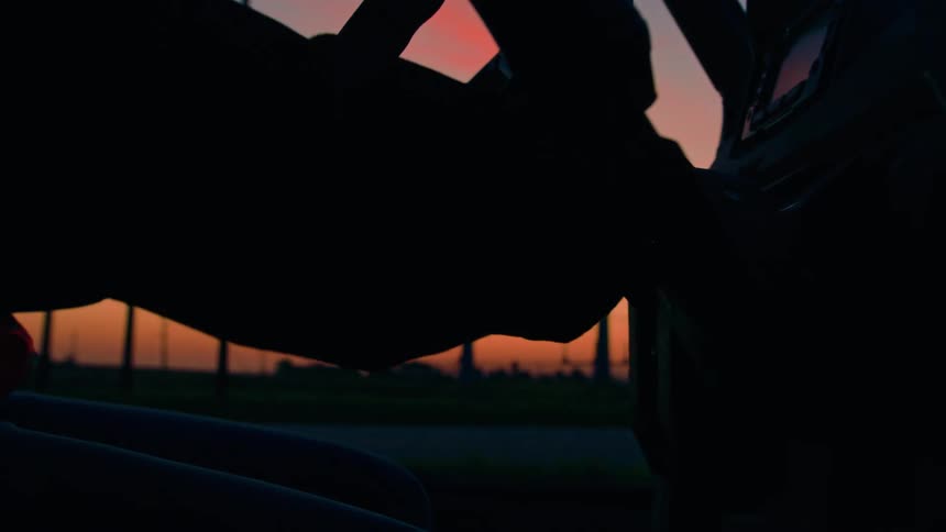 A person turns a key in the ignition