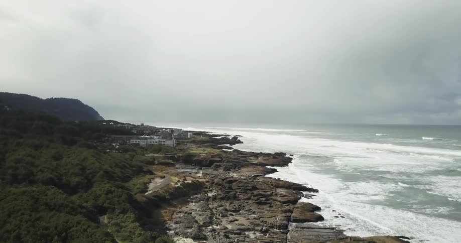 Water washes up on a rocky beach
