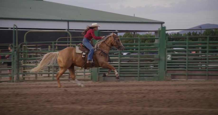 Woman riding a horse in a ranch