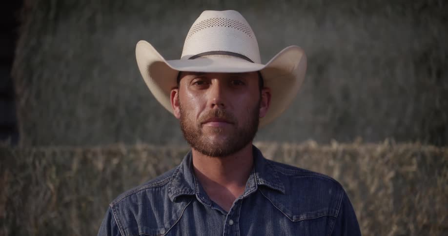 Portrait of a man with a white cowboy hat